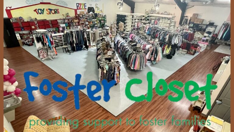 A big storage unit with clothes and toys in it