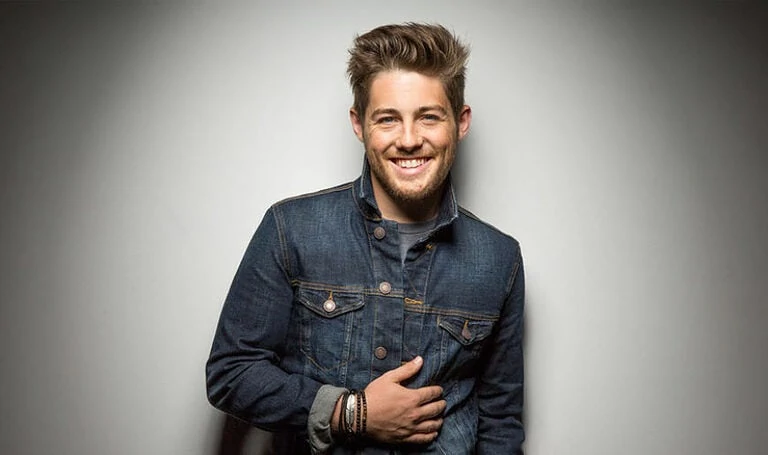 Bearded man smiling in denim jacket promoting The Promise, powerful message of hope and faith for spiritual growth.