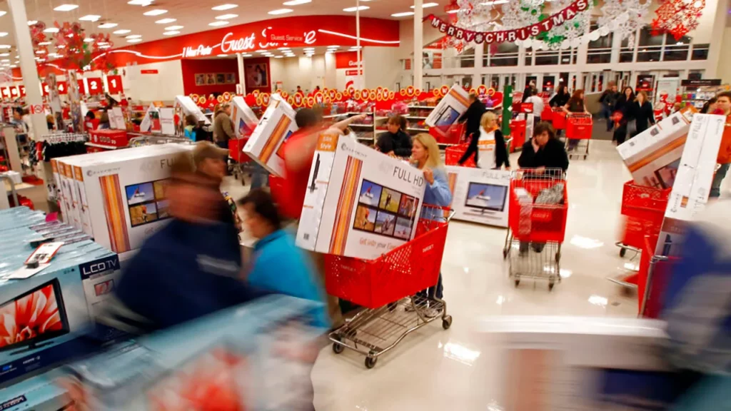A ton of people running in a store shopping