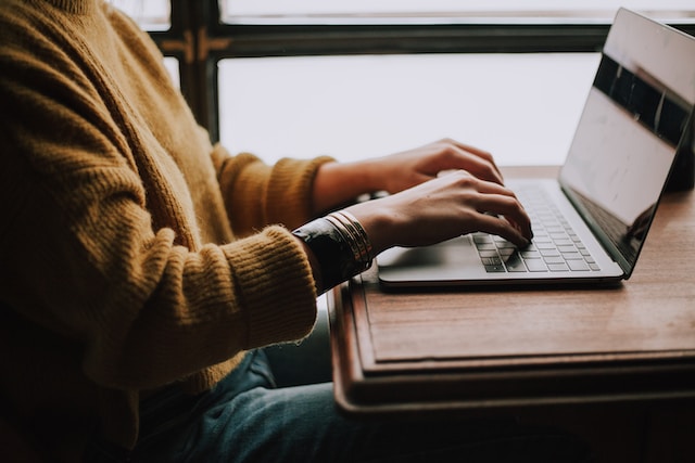 Someone typing on a computer