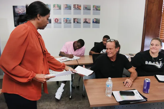 Released inmates that are working on filling out applications for future careers